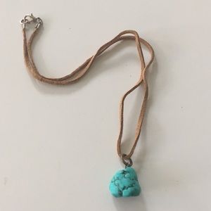 Turquoise color nugget necklace on tan suede